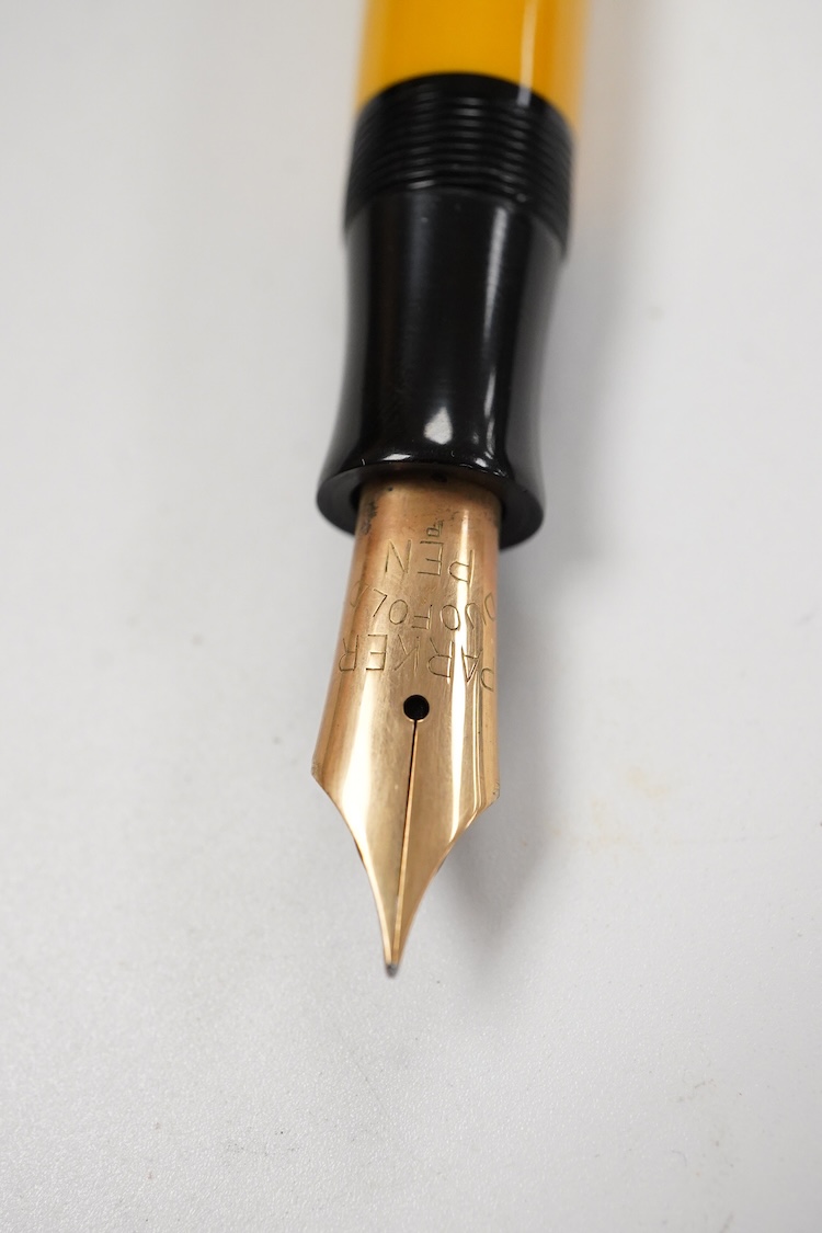 A Parker Lucky Curve Duofold Senior in mandarin yellow with 14ct Duofold nib